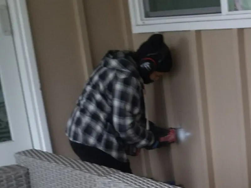 Professional electrician installing an exterior outlet in Buckingham