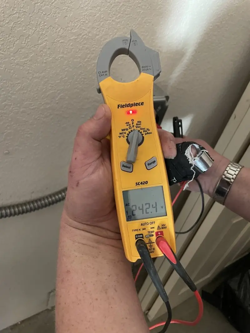 Voltage testing with clamp meter during Outlet Installation in Buckingham